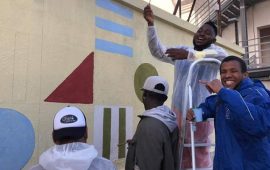 9 giovani immigrati realizzano un murale a Cagliari