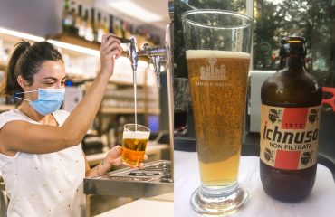 Photo session with a waitress with a face mask in a bar. New normality, security measures after the coronavirus pandemic, social distance, covid-19. Putting a glass with pole beer