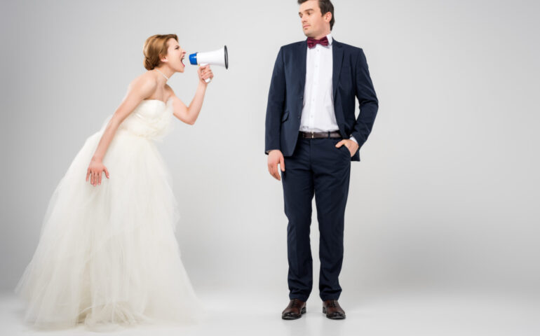 angry bride with megaphone yelling at groom, isolated on grey, feminism concept